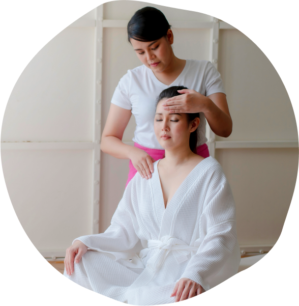 A client receiving a shoulder massage at Asiatic Thai Massage.