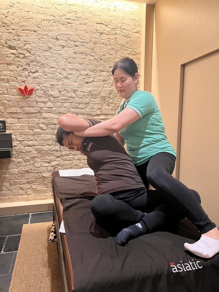 Massage therapist at Asiatic performing the best Thai massage in London/