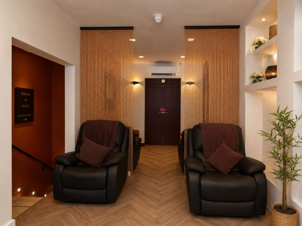 Asiatic Thai Massage welcoming area at 93 Upper Street with copper curtains, reclining chairs and calm boutique interior.