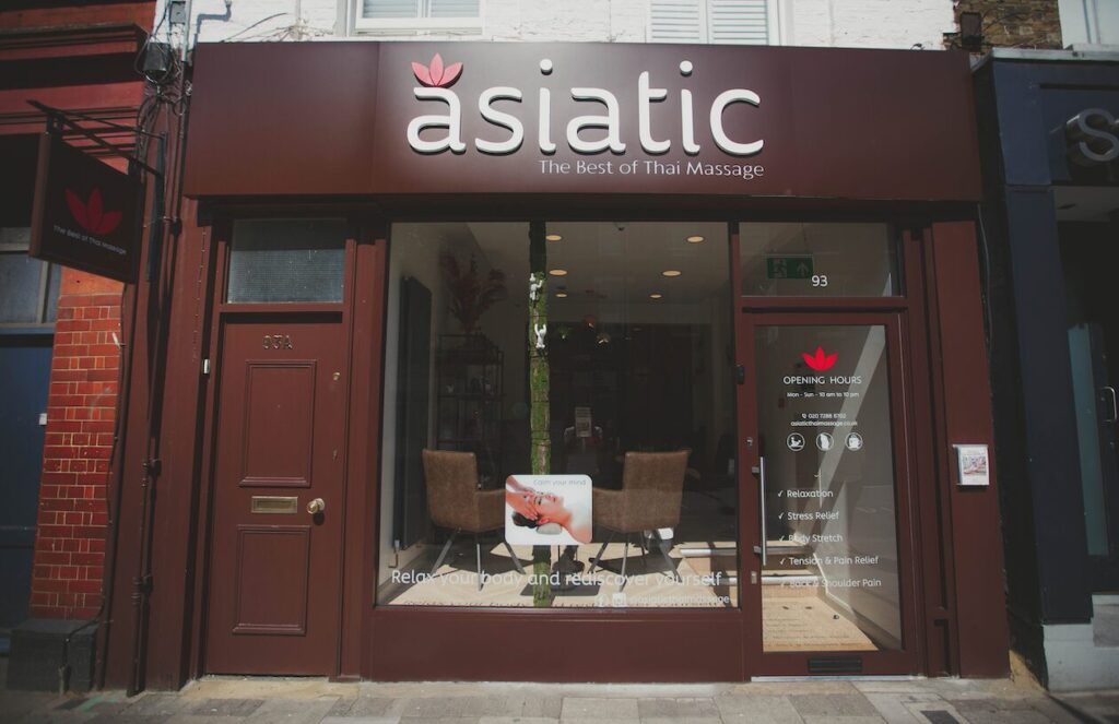 Image of a shop front with a prominent sign reading "Asiatic" and a tagline that says "the best of Thai massage