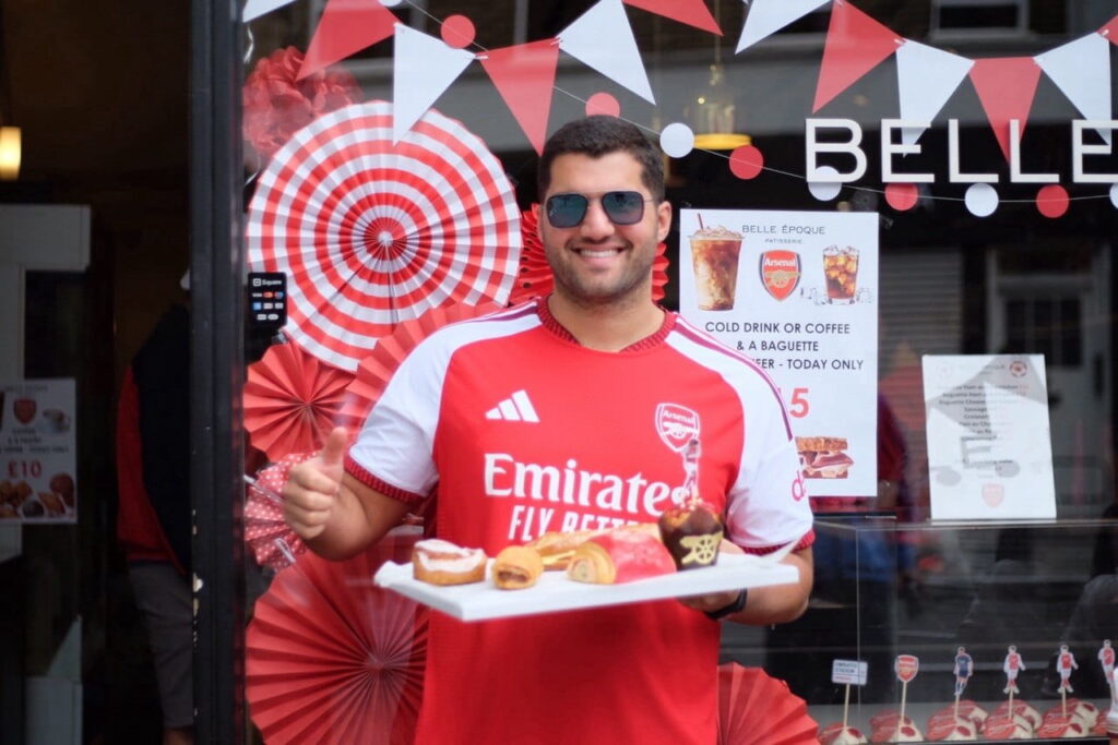 Arsenal fan near Belle Epoque in Upper Street, celebrating premier League title.