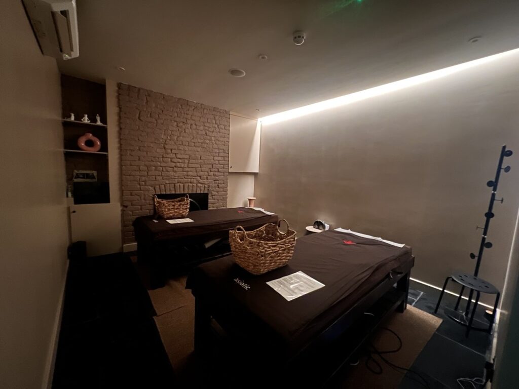 Detail of the breathable, non-toxic wall finishes at Asiatic Islington, utilising Paper Library and Little Greene paints for a healthy, clinical therapy environment.