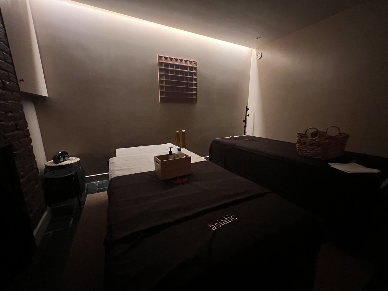 Best Couples massage London, at Asiatic Highbury in Islington featuring two treatment beds, warm lighting and a calm boutique wellness atmosphere.