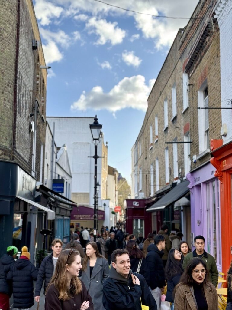 The vibrant, historic atmosphere of Camden Passage in Angel Islington, located just steps away from Asiatic Thai Massage for a post-treatment stroll.