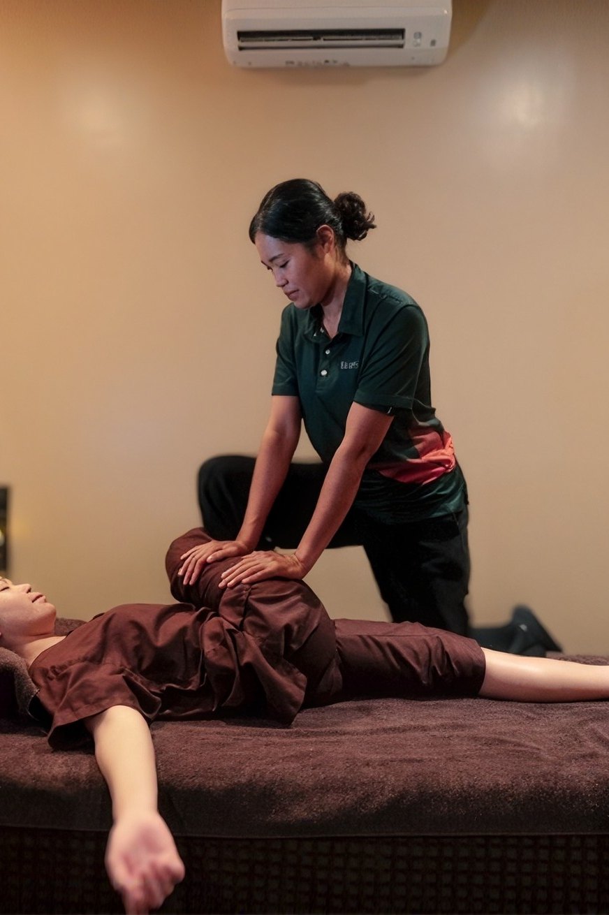 Asiatic therapist giving a treatment